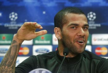 Alves gestures during a news conference at Joan Gamper training camp